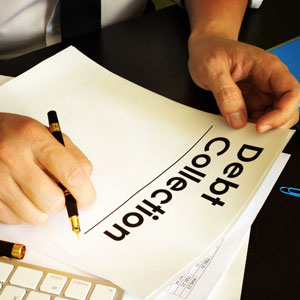 Man writing on a 'Debt Collection' document, symbolizing legal action.