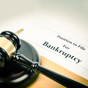 Bankruptcy petition and a gavel, symbolizing legal decisions after job loss.