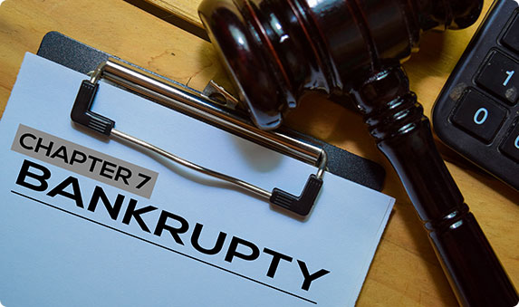 Bankruptcy document with 'Chapter 7' and a gavel on a clipboard.