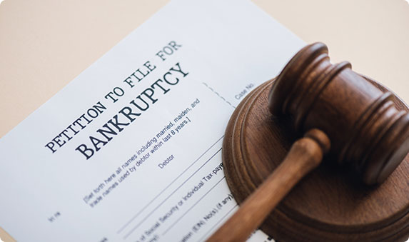 Petition to File for Bankruptcy document with a gavel, signifying legal action.